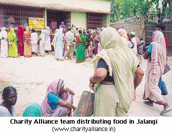 Charity Alliance team distributing food in Jalangi